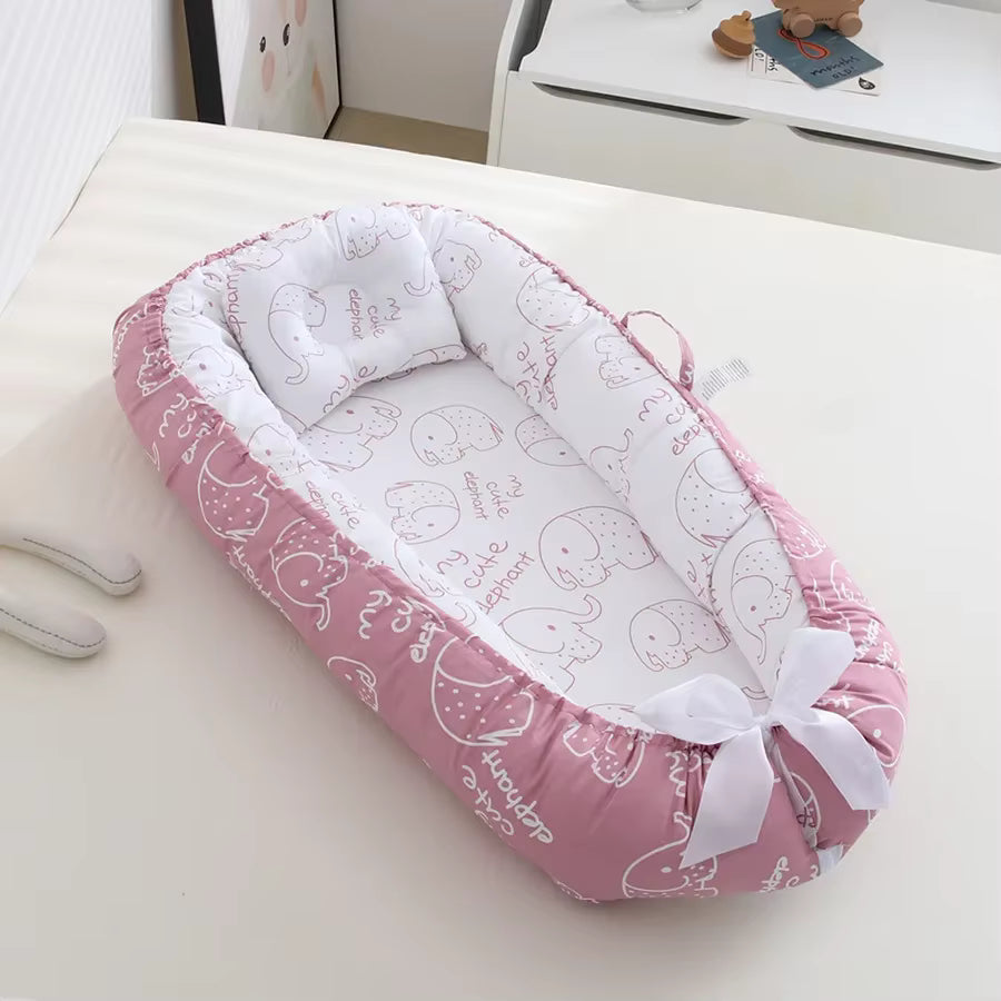 reducteur de lit bebe rose nid pour nouveau nee fille