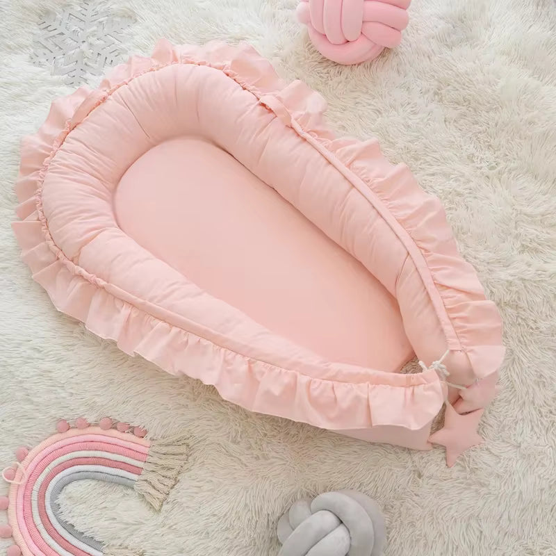 reducteur de lit bebe rose pour nouveau nee fille